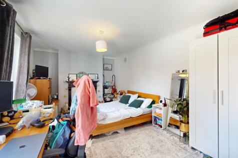 Bright and cozy double bedroom featuring a comf...
