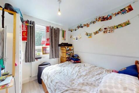 A cozy double bedroom featuring a comfortable w...