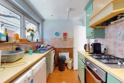 Bright and functional kitchen featuring ample c...