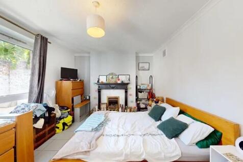 Bright and cozy double bedroom featuring a comf...