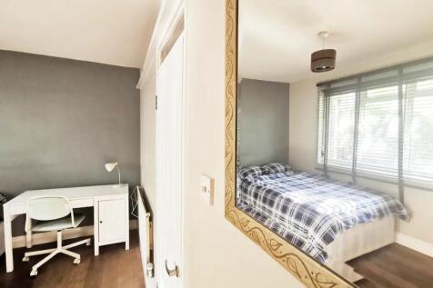Bright and inviting master bedroom featuring a ...