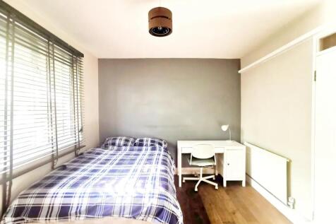 Bright and tidy double bedroom featuring a comf...