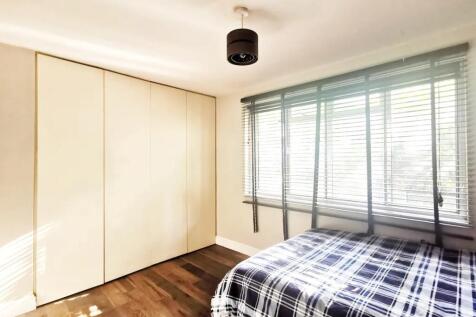 Bright and tidy double bedroom featuring a larg...