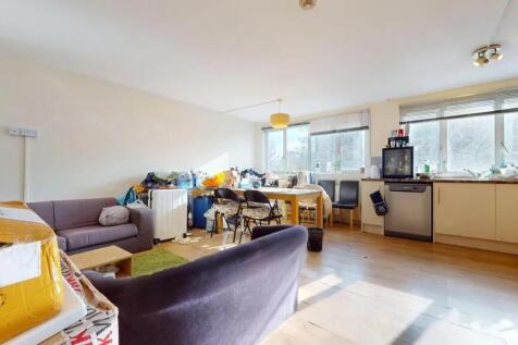 Bright and spacious living area with ample natu...