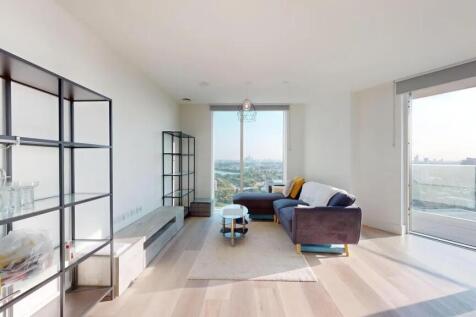 Bright and modern living room featuring a large...