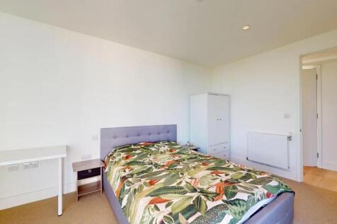 Bright and tidy double bedroom featuring a comf...