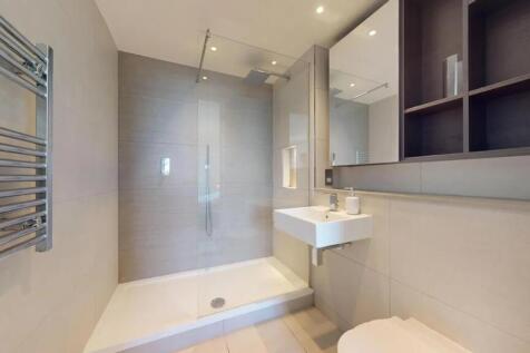 Modern and sleek bathroom featuring a spacious ...