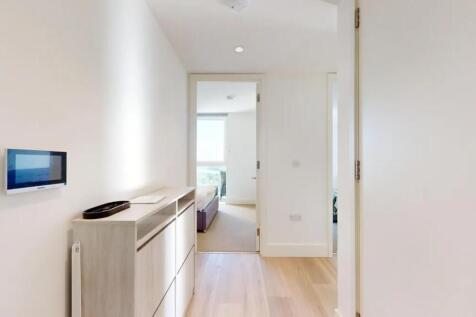 Bright and modern hallway featuring light wood ...