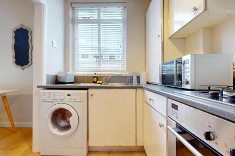 Bright and well-maintained kitchen featuring mo...