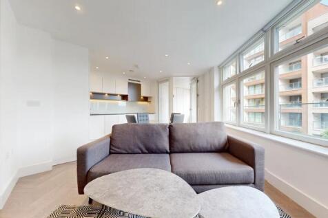 Bright and modern living room featuring a large...