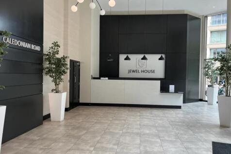 A spacious and modern reception area featuring ...