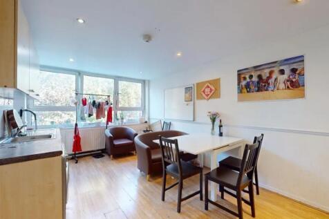 Bright and functional kitchen area featuring la...