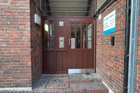 Secure entrance to a brick terraced building fe...