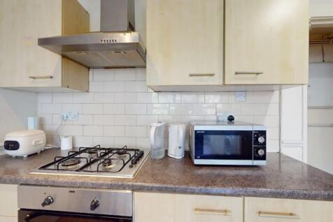 A tidy and functional kitchen featuring a gas h...