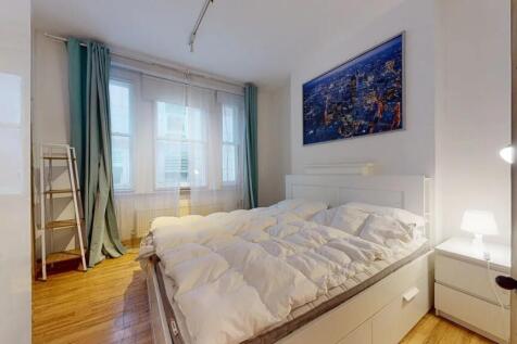 Bright and inviting double bedroom featuring a ...