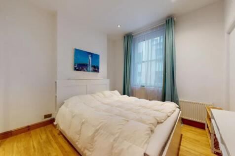 Bright and cozy double bedroom featuring a comf...