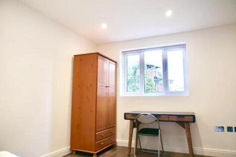 Bright and tidy single bedroom featuring a larg...
