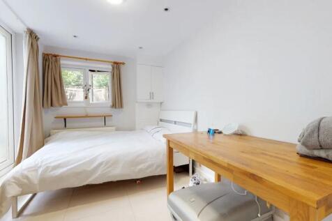 Bright and tidy double bedroom featuring a comf...
