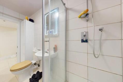 Bright and functional bathroom featuring a tile...