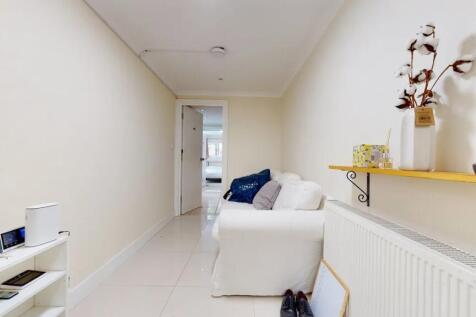 A clean and bright hallway featuring light-colo...