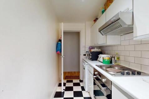 Bright and clean galley kitchen featuring moder...