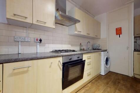 Bright kitchen featuring light wood cabinetry, ...