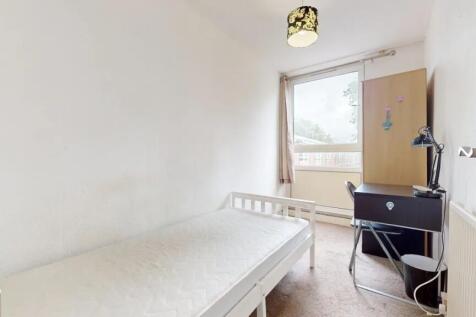A bright and tidy single bedroom featuring a wh...