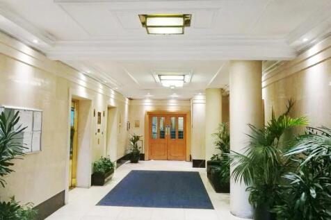 Bright and spacious reception area featuring el...