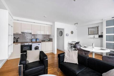A modern and inviting open-plan living area fea...