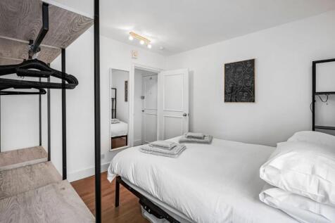 Bright and inviting double bedroom featuring cr...