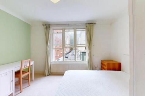 Bright and airy double bedroom featuring a larg...