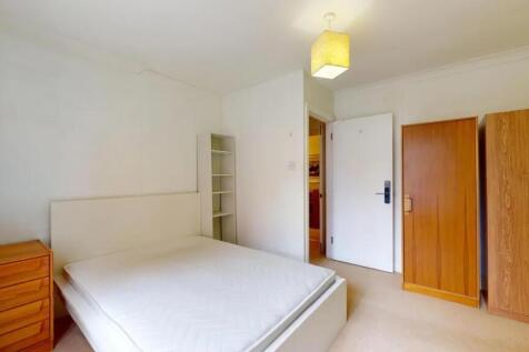 Bright and tidy double bedroom featuring a comf...