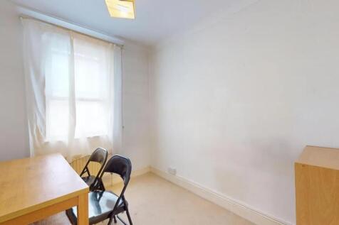 Bright and simple communal workspace featuring ...