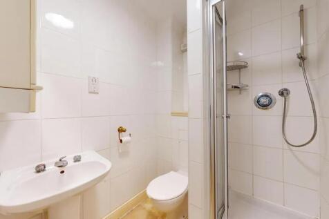A clean, well-maintained bathroom featuring a c...