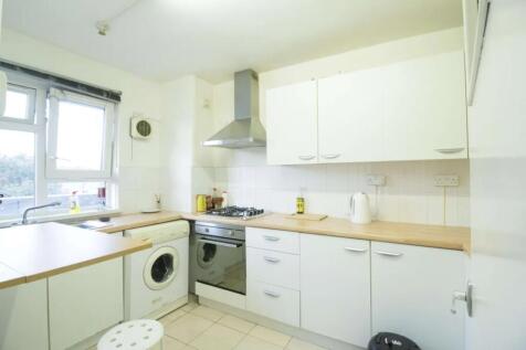 Bright and tidy kitchen featuring ample counter...