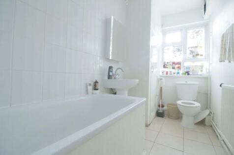 Bright and clean bathroom featuring a full-size...