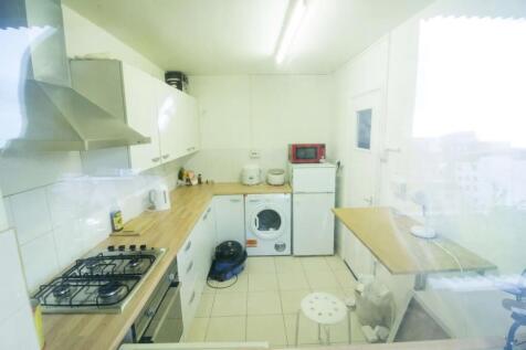 Bright and practical kitchen featuring modern a...