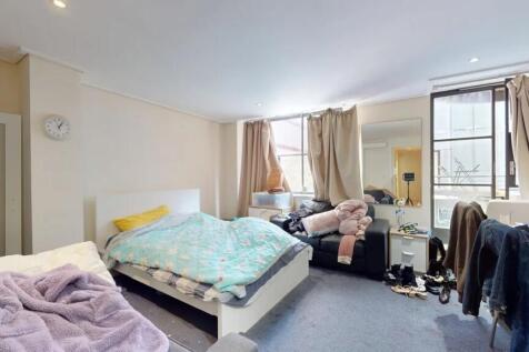 Bright double bedroom featuring a comfortable b...