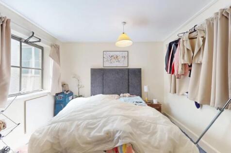 Bright and cozy double bedroom featuring a comf...