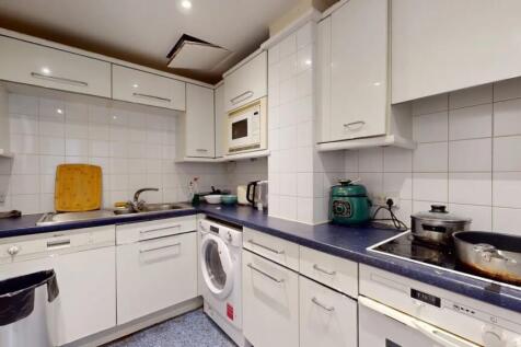 Bright and functional kitchen featuring ample w...