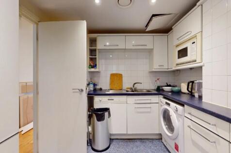 A compact, well-maintained kitchen featuring mo...
