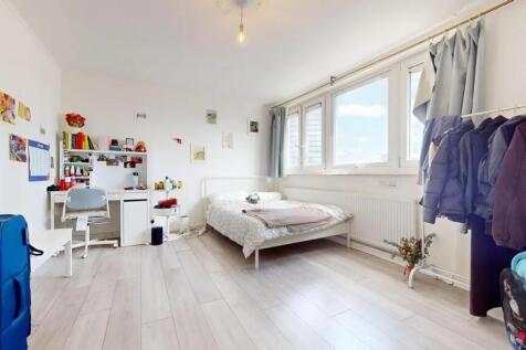 A bright and airy double bedroom featuring a co...