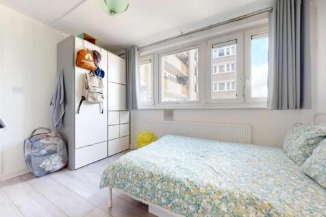 A bright and tidy double bedroom featuring a la...