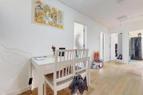 Bright and clean hallway with light wooden floo...