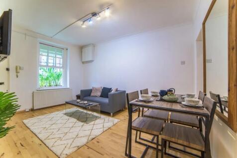 Bright and modern living room featuring a cozy ...