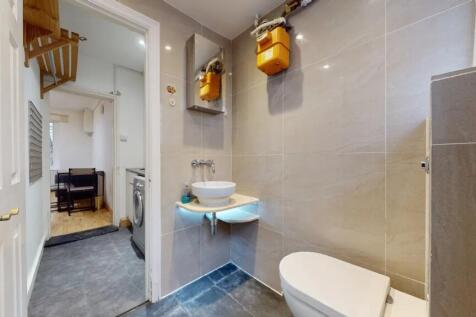 A modern and well-maintained single toilet with...