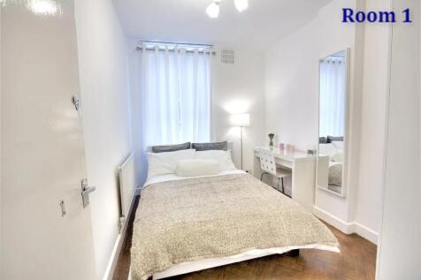 A bright and clean double bedroom featuring a c...