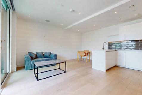 Bright and modern living space featuring a comf...