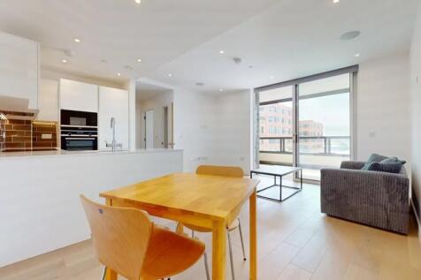 A modern, bright living room with an open-plan ...