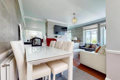 A stylish and bright living room featuring a co...